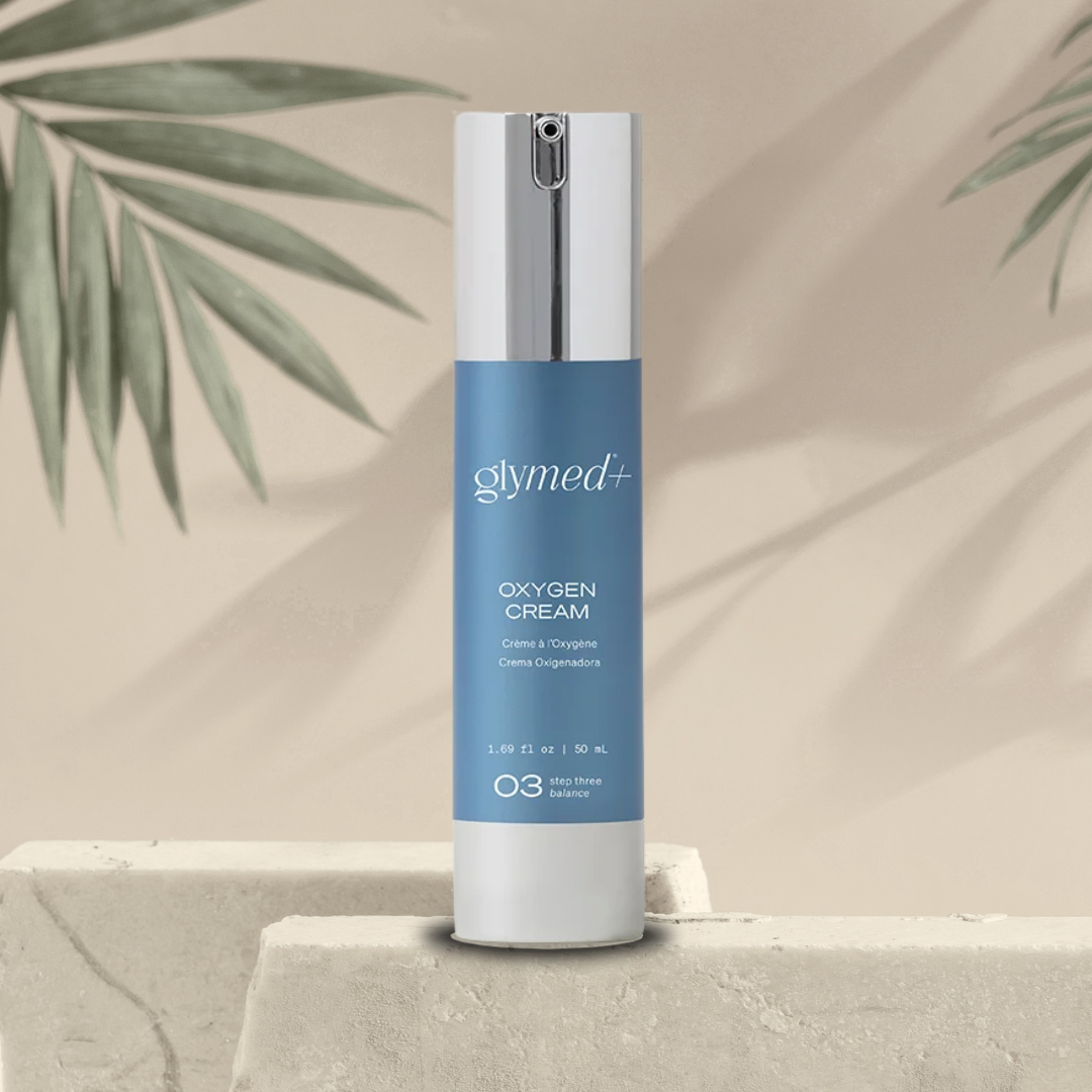 Glymed Oxygen Cream bottle on a neutral background with green leaves